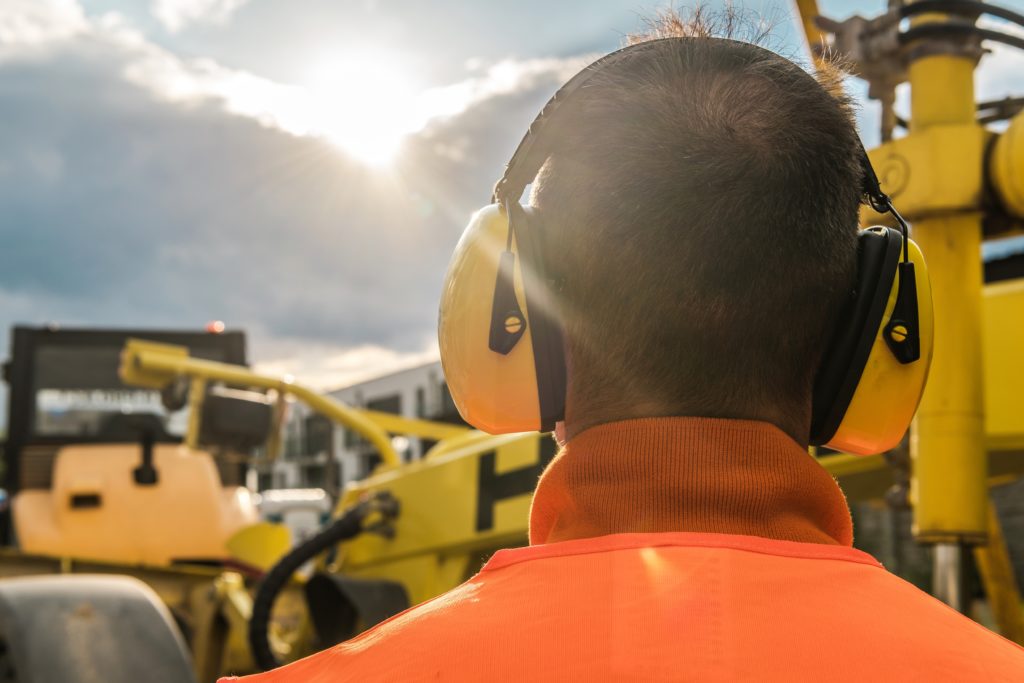 man wearing hearing protection gear at jobsite